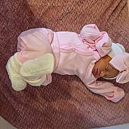 Rayanna-Rose is registered to the contest to win money with this photo: newborn, baby, sleeping, pink_clothing, bow, blanket, soft_texture, infant, cute, cozy, headwear, portrait, resting, tiny, child, indoors, peaceful, wrapped, sock, sleep