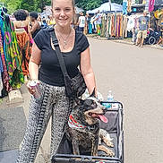 Josie joined the competition — help win amazing prizes! accessory, bag, bandana, can, casual, clothing, dog, festival, market, necklace, outdoor, pavement, people, shopping, smiling, summer, sunny, trees, wagon, woman