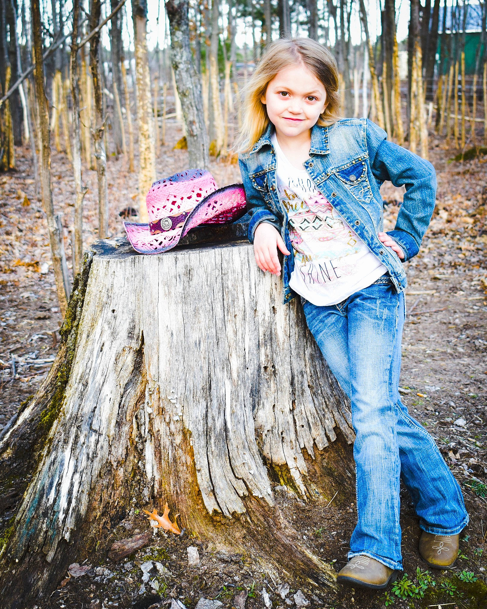 Mallory is registered to the contest to win money with this photo: beauty, blond, brown_hair, child_model, fashion, grass, hair, jeans, joy, long_hair, people, people_in_nature, person, photograph, photography, portrait_photography, sitting, tree, tree_stump, trunk