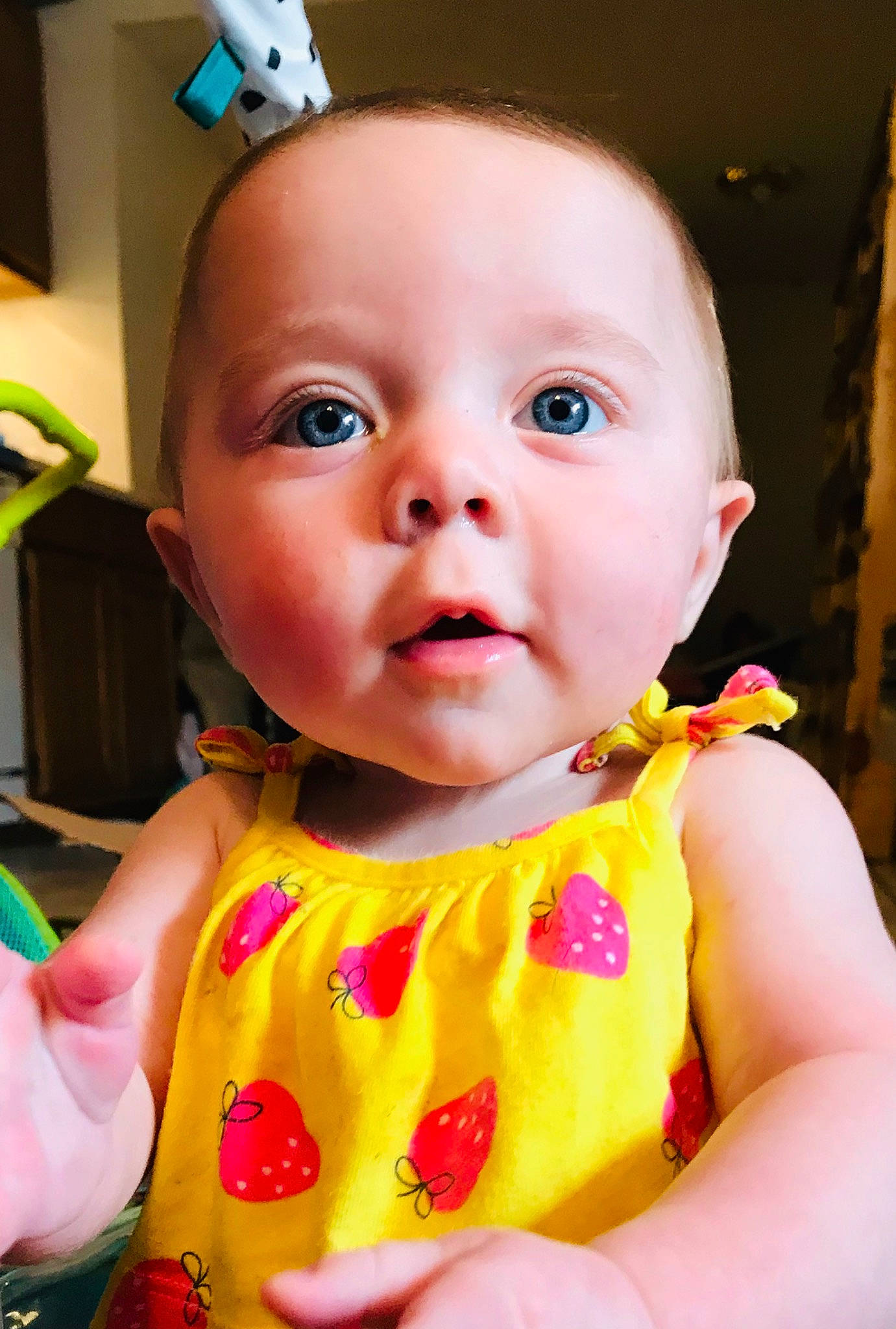 Mavis is registered to the contest to win money with this photo: baby, cheek, child, dress, ear, eye, face, head, iris, lip, nose, person, pink, skin, smile, toddler, yellow