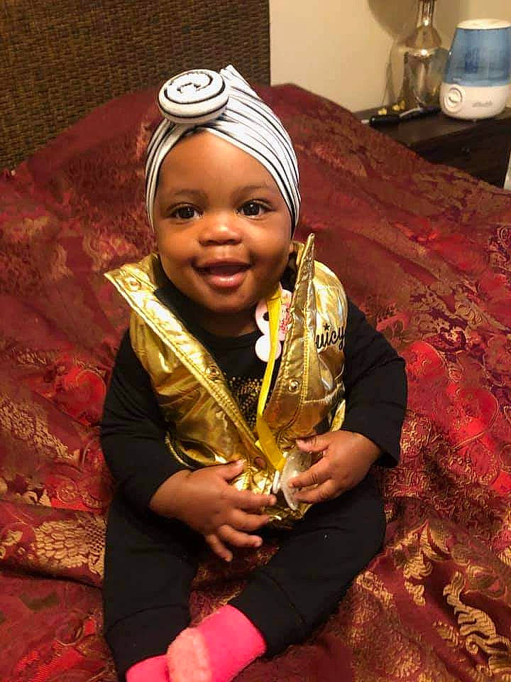 Aunesti is registered to the contest to win money with this photo: baby, eye, face, fashion_accessory, flooring, fun, happy, head, headpiece, human_body, jewellery, joy, nail, necklace, person, room, sari, sitting, smile, thumb