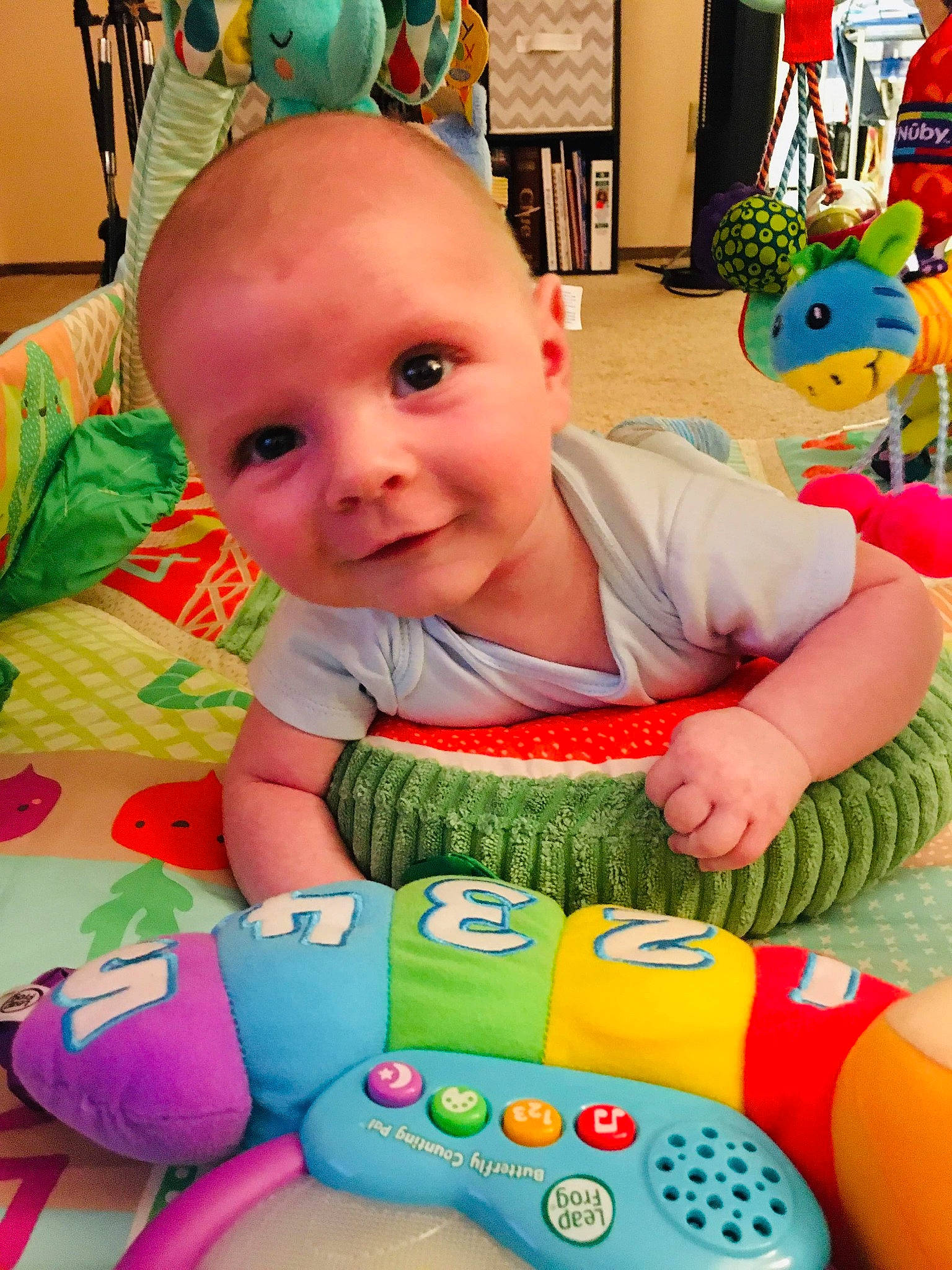 Casey joined the competition — help win amazing prizes! baby, baby_playing_with_toys, baby_products, baby_toys, child, electronic_device, person, play, product, skin, stuffed_toy, technology, textile, toddler, toy, tummy_time