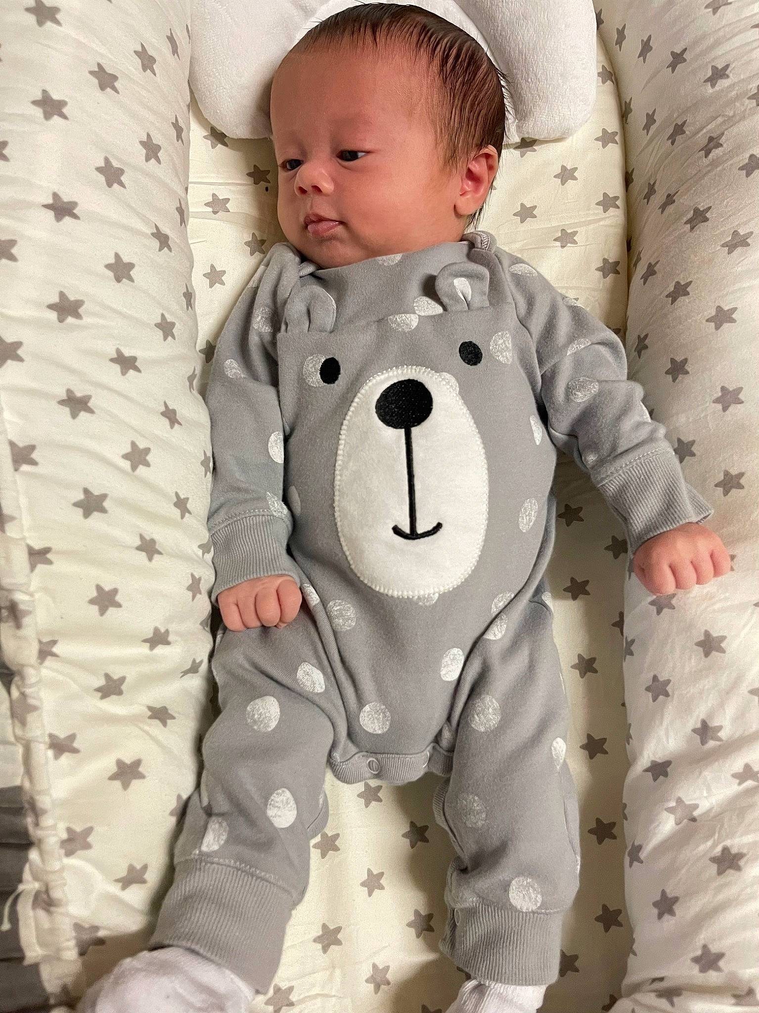 Emerson is registered to the contest to win money with this photo: baby, baby_products, baby_toddler_clothing, child, collar, comfort, dress_shirt, linens, pattern, person, product, sitting, sleeve, textile, toddler, white
