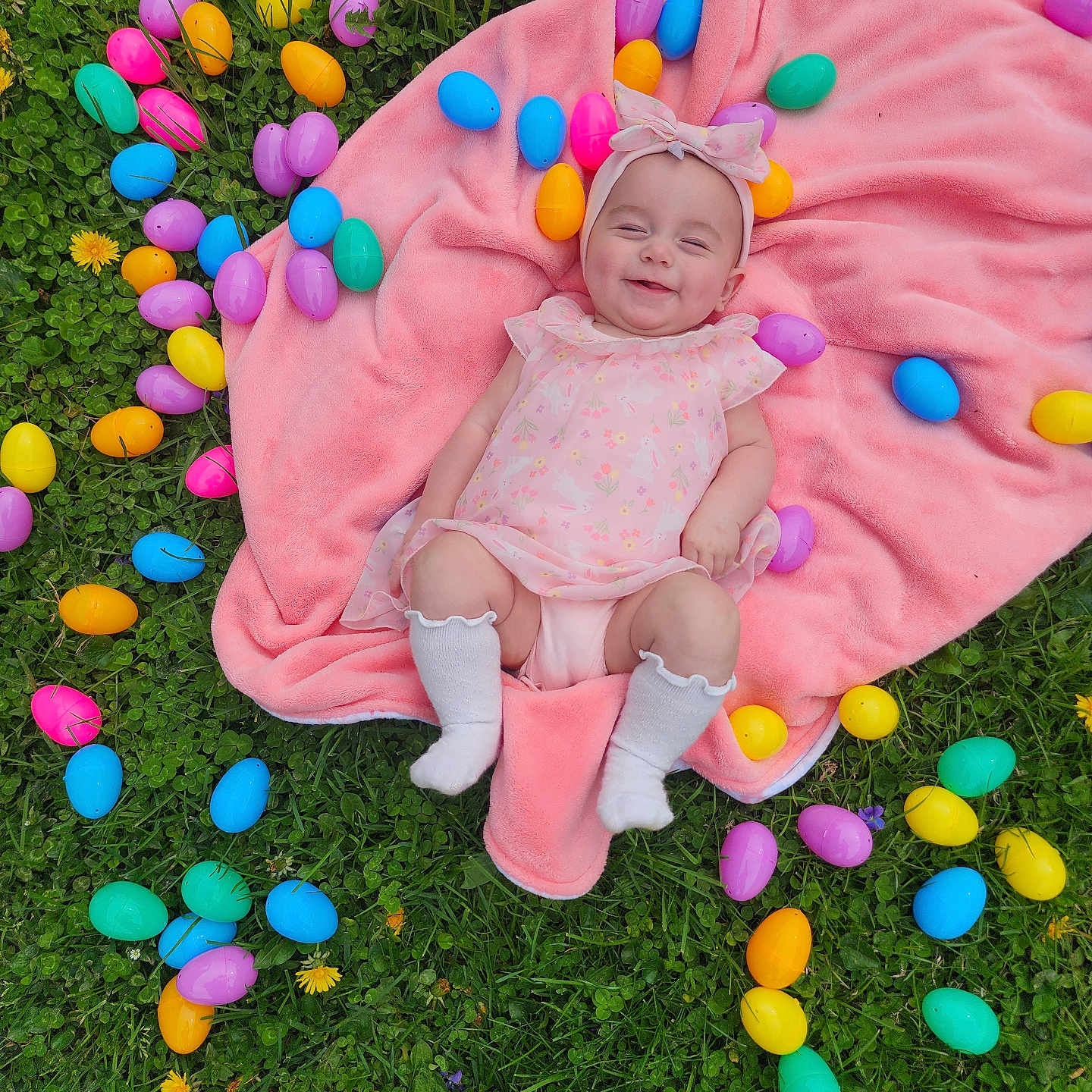 Kylenne is registered to the contest to win money with this photo: baby, balloon, blanket, clothing, egg, face, food, grass, head, hosiery, medication, newborn, people, person, photography, pill, plant, portrait, purple, sock