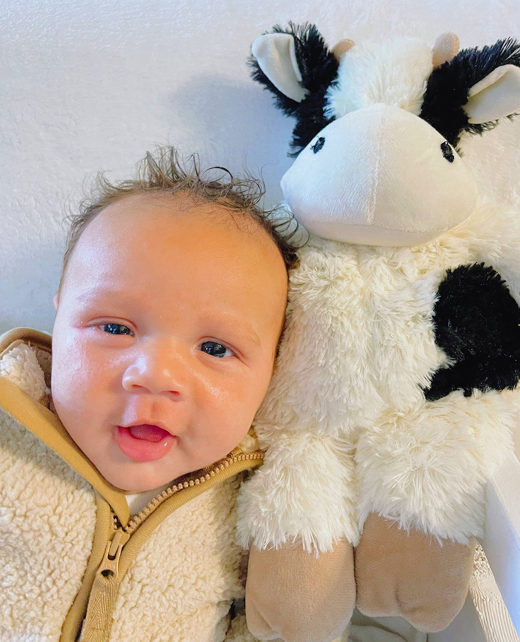 Khalil is registered to the contest to win money with this photo: baby, baby_toddler_clothing, cheek, comfort, ear, eye, eyelash, fur, fur_clothing, happy, iris, lip, nose, person, plush, smile, stuffed_toy, textile, toddler, toy