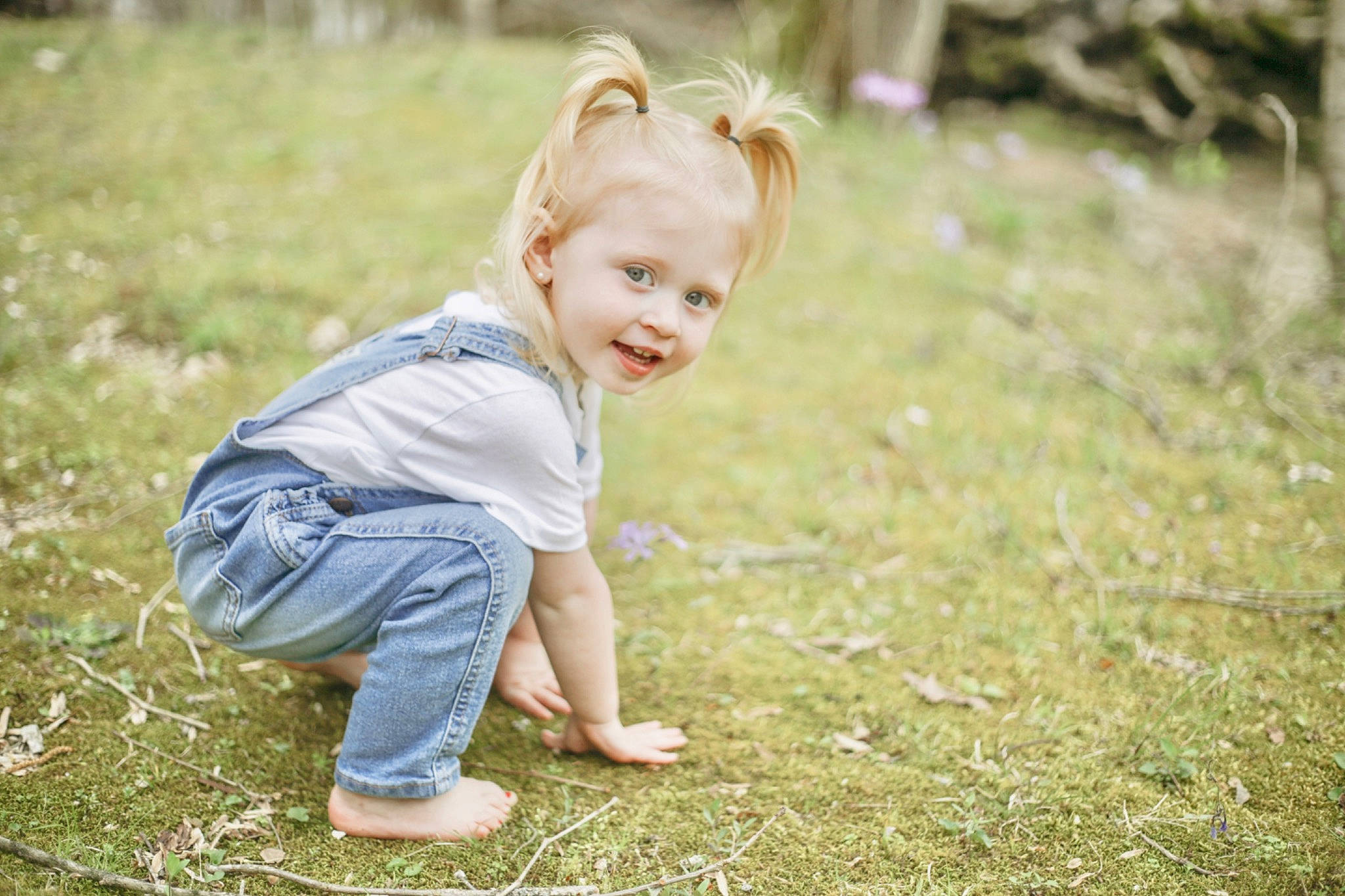 Addison is registered to the contest to win money with this photo: baby_toddler_clothing, child, flash_photography, flooring, fun, grass, grass_family, grassland, happy, lawn, meadow, people_in_nature, person, plant, play, prairie, sitting, smile, soil, toddler