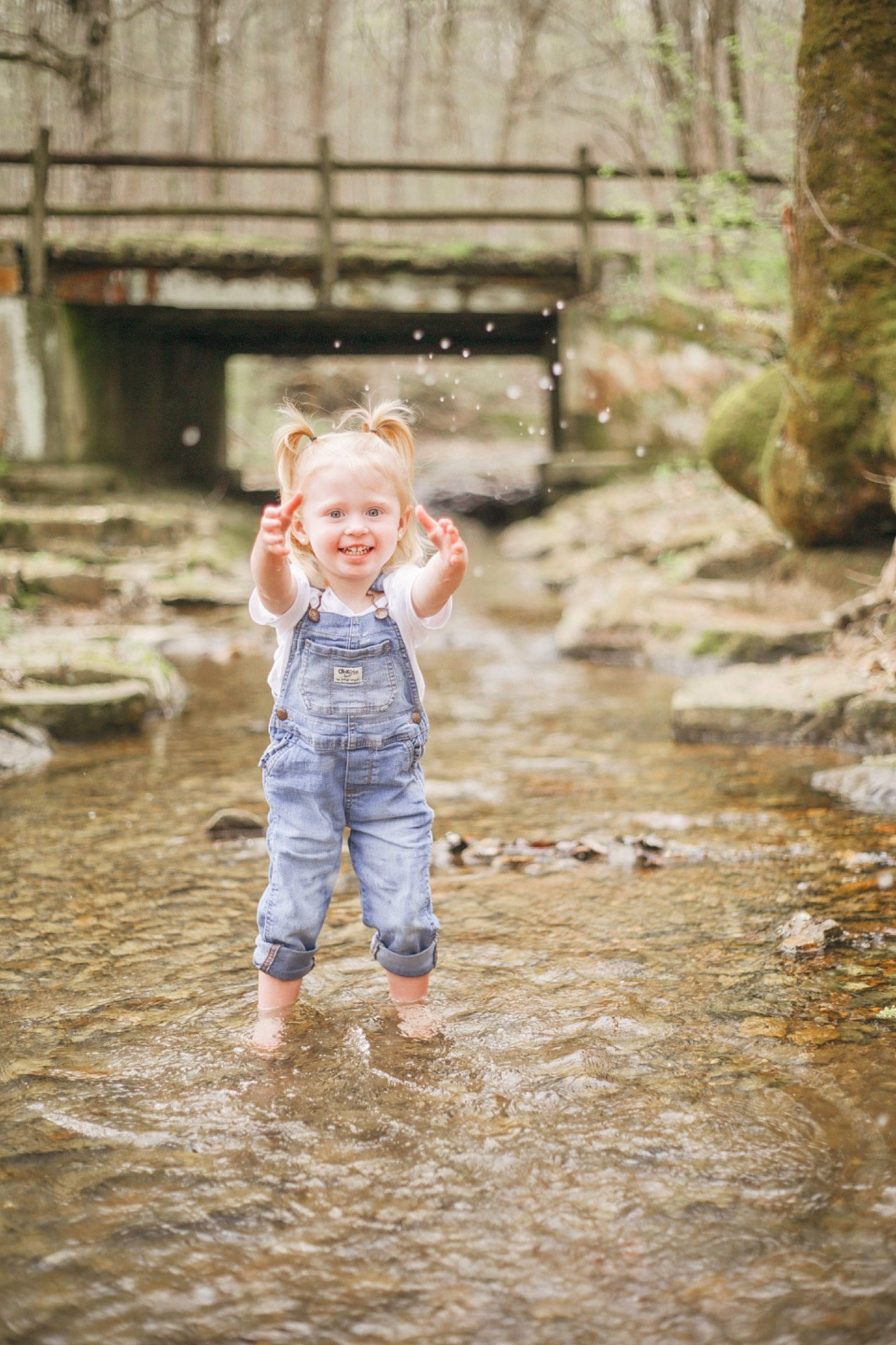 Addison is registered to the contest to win money with this photo: child, flash_photography, flooring, fun, grass, happy, joy, landscape, leaf, leisure, people_in_nature, person, play, reflection, rock, sitting, smile, soil, spring, toddler