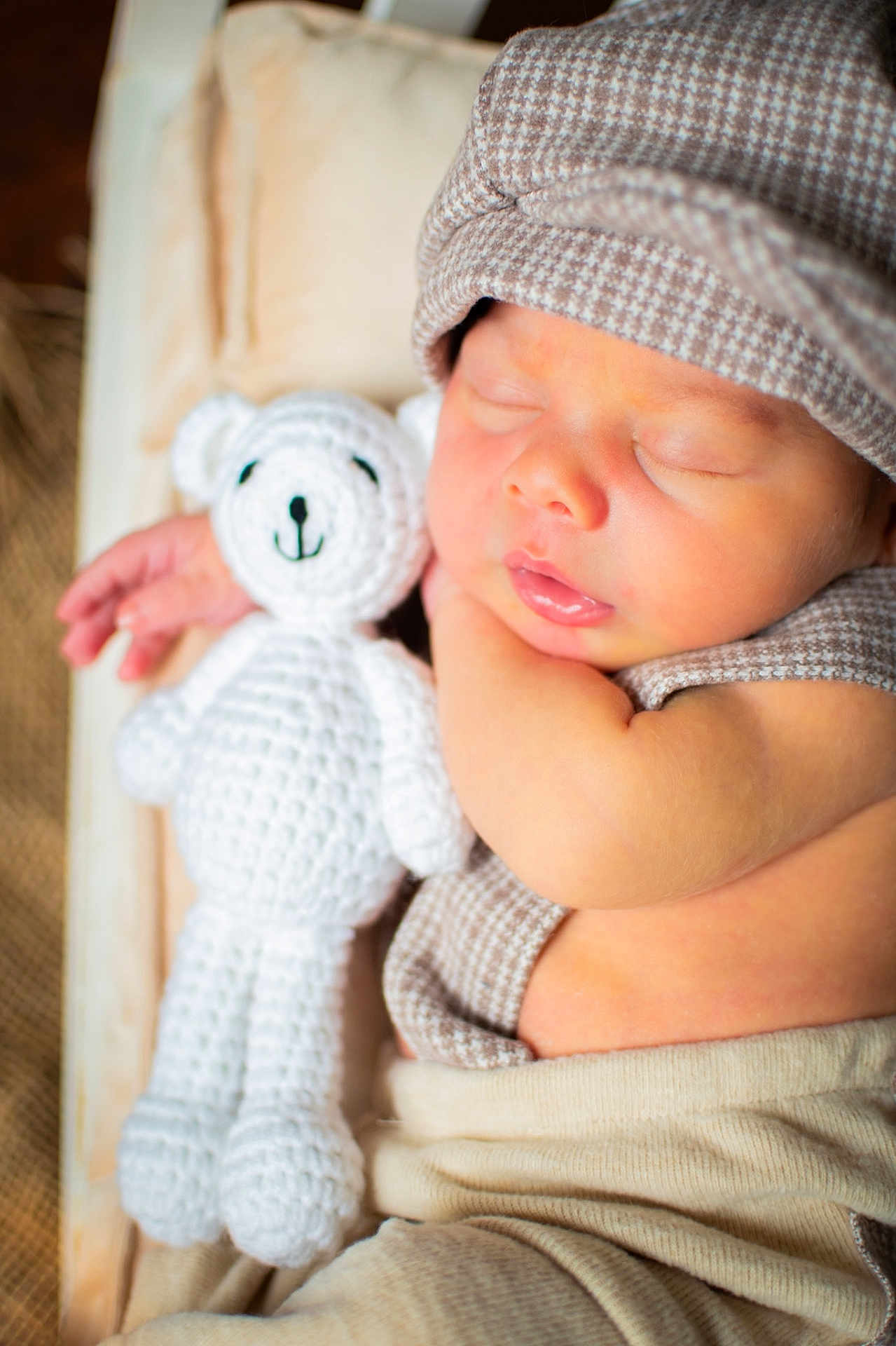 Zayyden joined the competition — help win amazing prizes! baby, sleeping, teddy_bear, crochet, hat, infant, cute, peaceful, soft, cozy, child, portrait, resting, hand, clothing, fabric, closeup, indoors, newborn, relaxed
