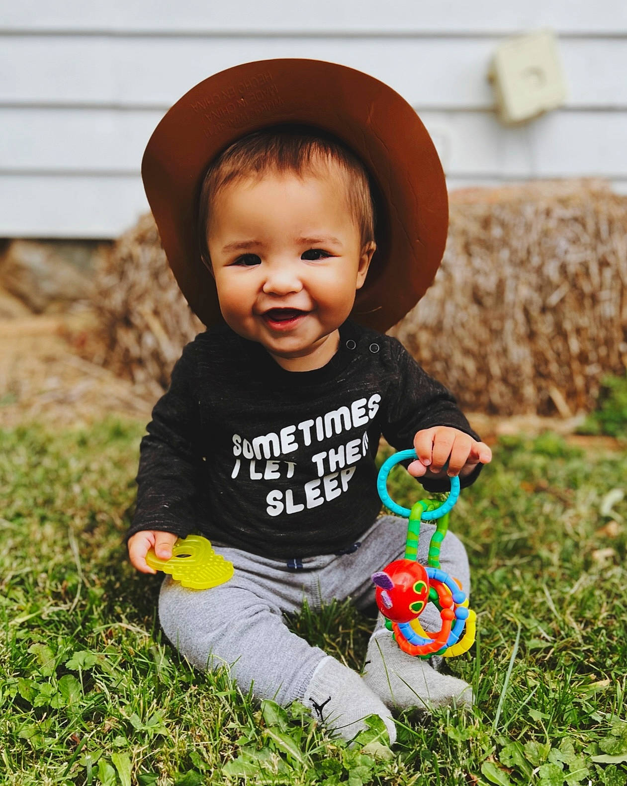 Sterling is registered to the contest to win money with this photo: baby, baby_toddler_clothing, cap, child, cool, costume_hat, face, fashion_accessory, fun, grass, happy, hat, joy, lawn, mammal, people_in_nature, person, plant, smile, sun_hat