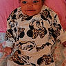 Kali joined the competition — help win amazing prizes! baby, infant, child, mickey_mouse, leopard_print, bow, headwear, blanket, clothing, patterned_clothing, smiling, lying_down, cute, portrait, indoor, person, toddler, fabric, colorful, soft