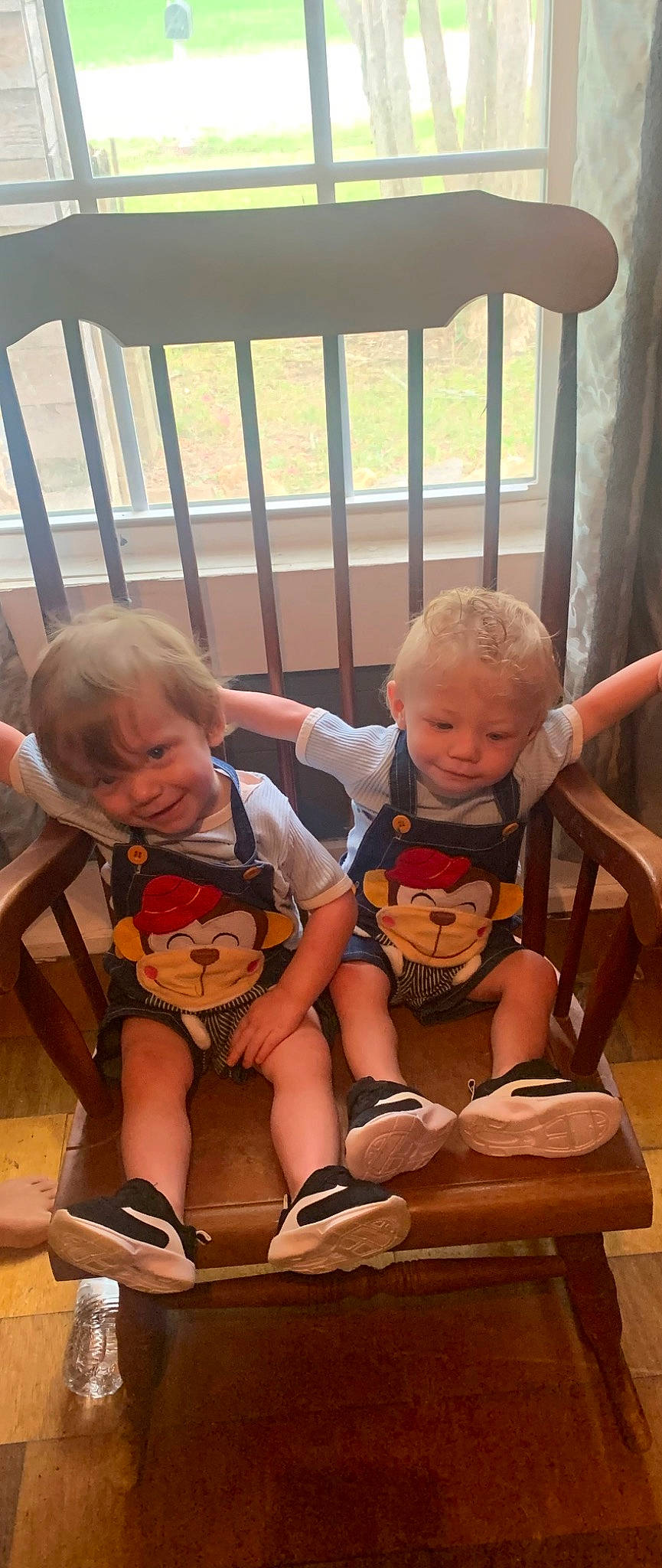 Micah And Elias is registered to the contest to win money with this photo: baby, chair, child, fun, happy, lap, leg, leisure, orange, people, person, sharing, shoe, shorts, skin, smile, sneakers, t_shirt, thigh, toddler