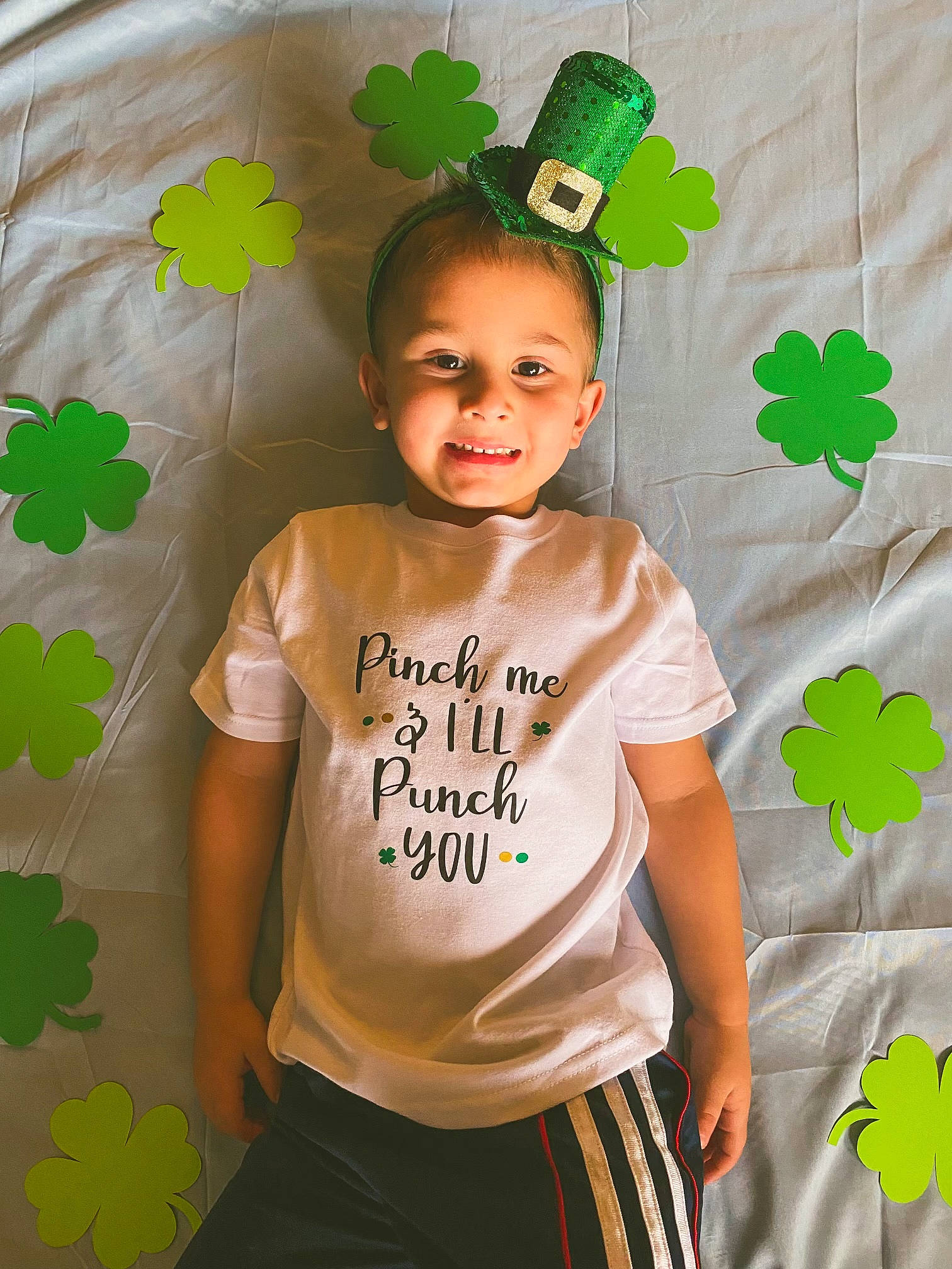 Tregan is registered to the contest to win money with this photo: adaptation, baby_toddler_clothing, child, event, facial_expression, fashion_accessory, green, happy, holiday, joy, leaf, pattern, person, shamrock, shorts, sleeve, smile, standing, t_shirt, toddler