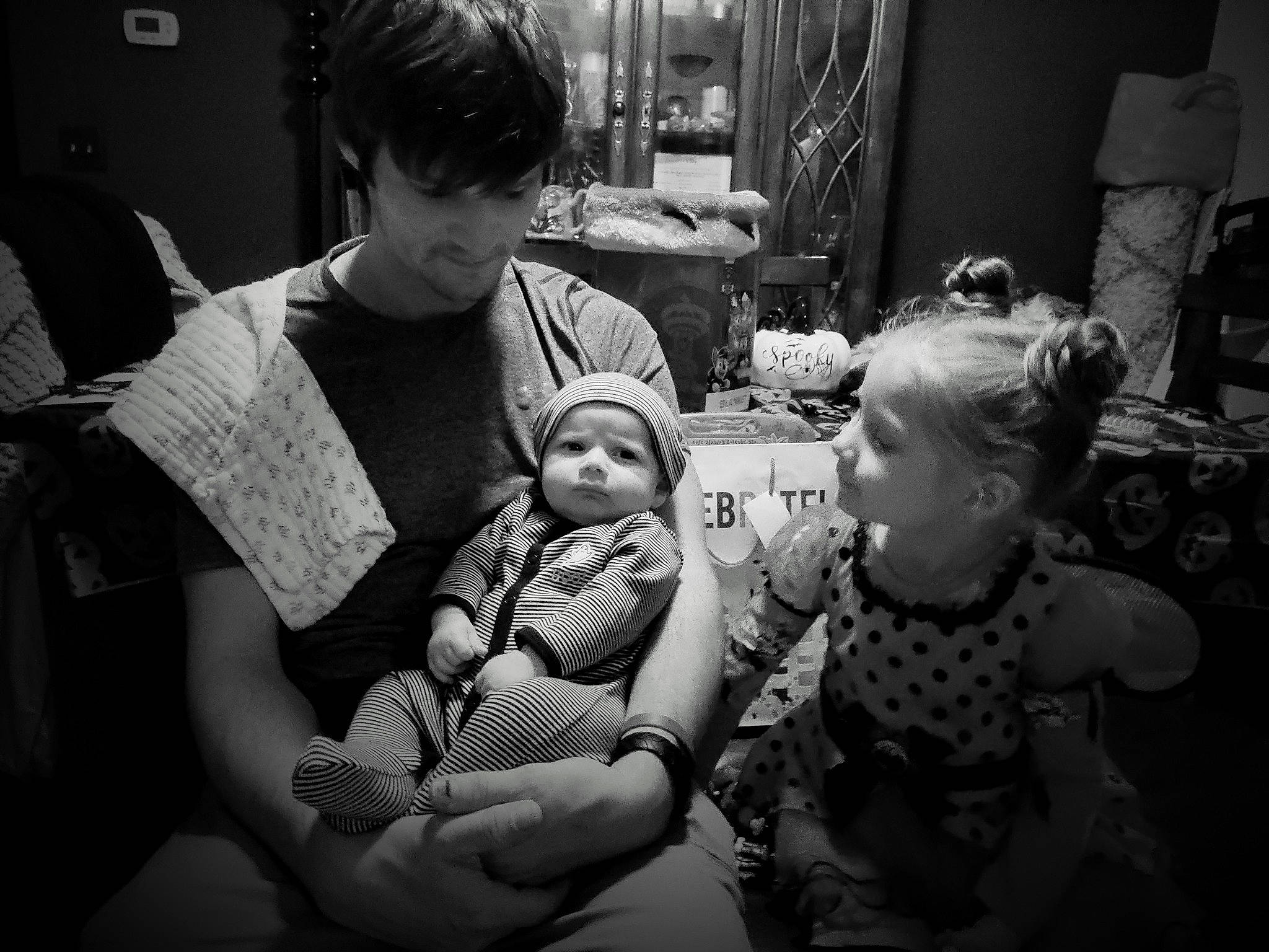 Ryker joined the competition — help win amazing prizes! baby, black_and_white, child, comfort, event, facial_expression, flash_photography, fun, happy, headwear, interaction, mammal, monochrome, monochrome_photography, person, room, sitting, style, toddler, toy