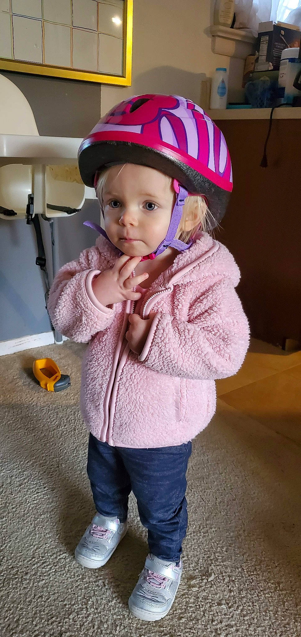 Avri is registered to the contest to win money with this photo: child, clothing, fashion_accessory, hat, headgear, outerwear, person, personal_protective_equipment, pink, sun_hat, toddler