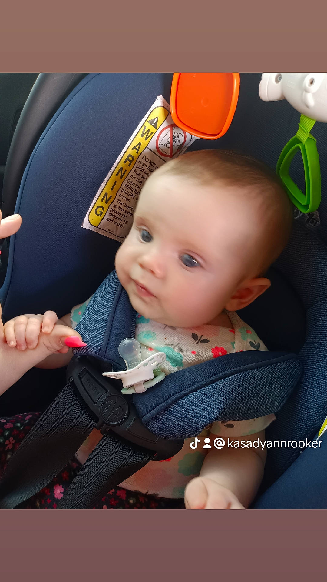 Rebecca is registered to the contest to win money with this photo: arm, baby, baby_carriage, baby_in_car_seat, baby_products, baby_safety, baby_toddler_clothing, car_seat, cheek, child, comfort, finger, fun, hand, happy, person, seat_belt, sitting, skin, steering_wheel