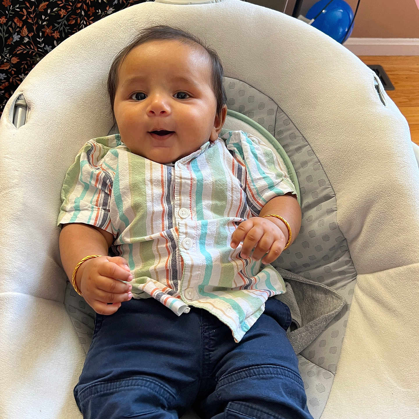 Madhav joined the competition — help win amazing prizes! baby, baby_seat, blue_pants, bracelets, casual_clothing, child, comfort, cushion, cute, floor, happy, home, indoors, infant, person, portrait, smiling, striped_shirt, wooden_floor, young_child