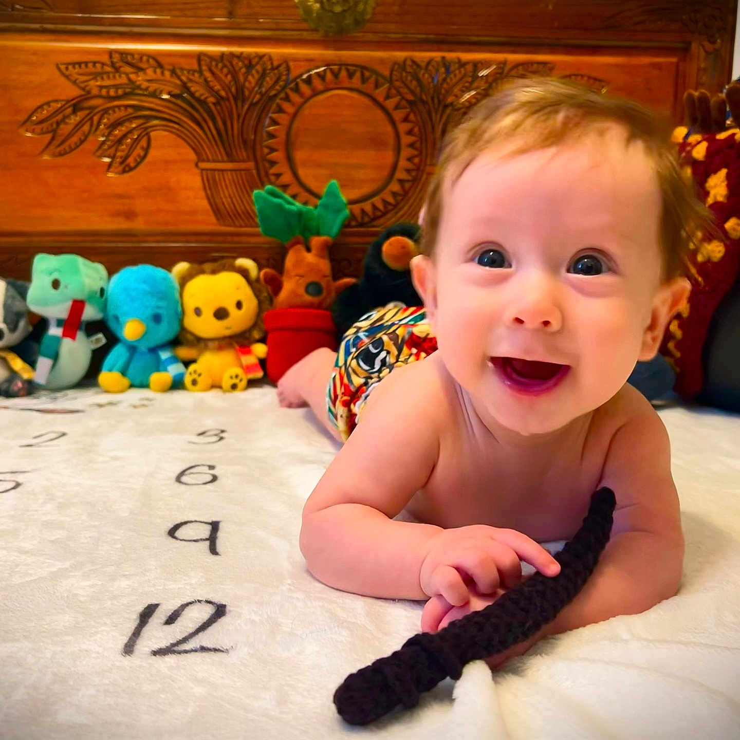 Solis is registered to the contest to win money with this photo: baby, babylaughing, bed, bedroom, face, furniture, happy, head, indoors, laughing, newborn, person, photography, plush, portrait, quilt, room, smile, toy