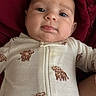 Alora is registered to the contest to win money with this photo: animal_print, baby, blanket, child, clothing, comfort, cute, drool, expression, face, indoors, infant, lying_down, onesie, portrait, red_blanket, skin, soft_texture, warm, young