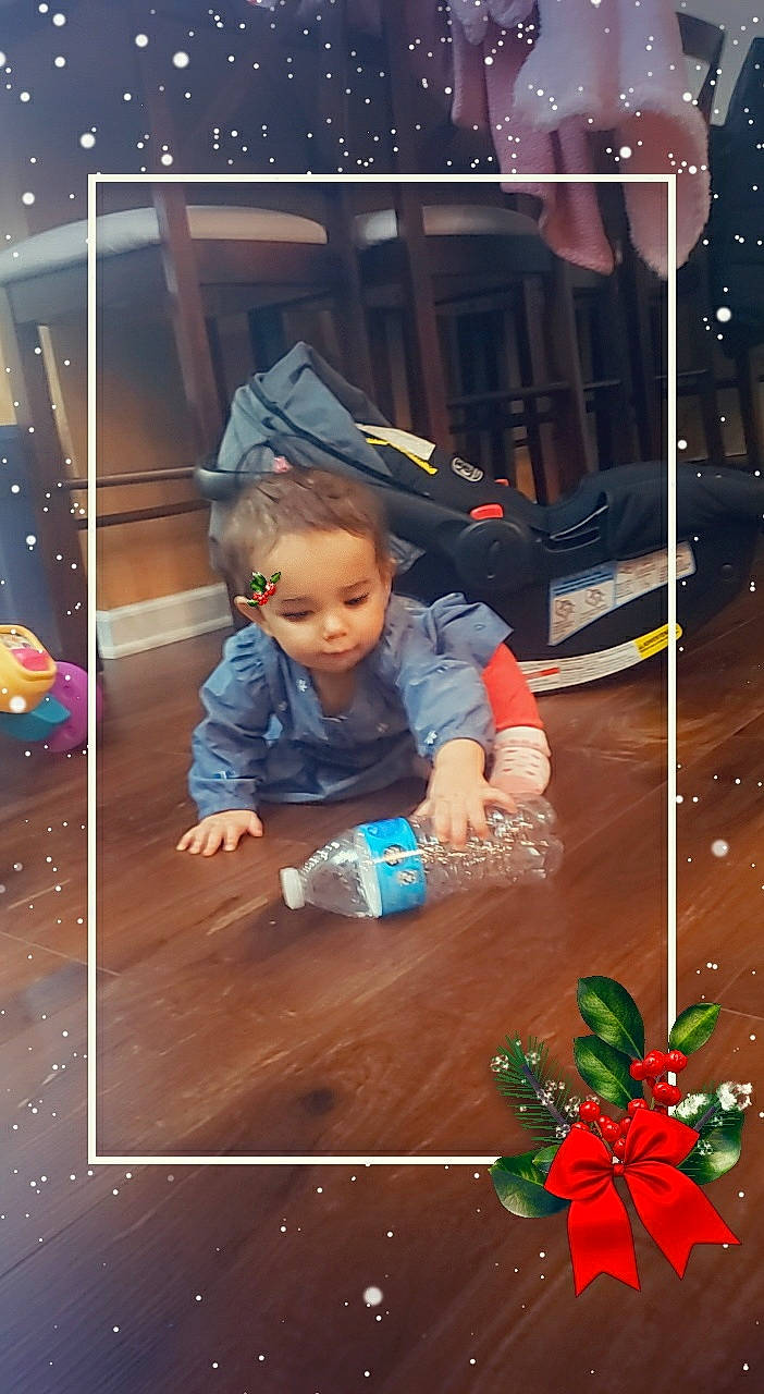 Janelise is registered to the contest to win money with this photo: astronomical_object, baby, baby_toddler_clothing, curious, fruit, holiday, person, play, space, star, toddler