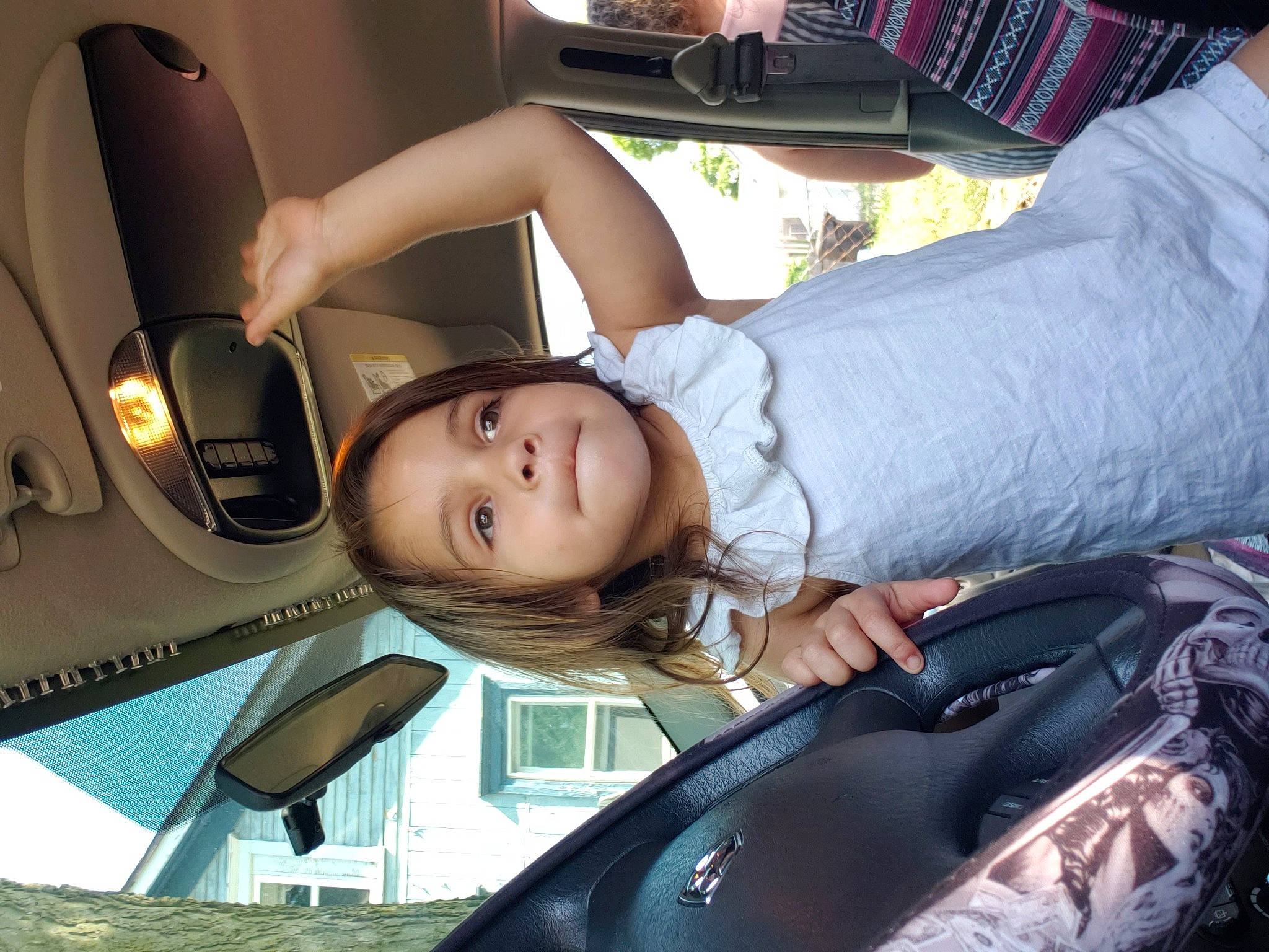 Analise joined the competition — help win amazing prizes! auto_part, black_hair, car, car_seat, child, cool, eyewear, glasses, leg, person, photography, sitting, smile, vacation, vehicle