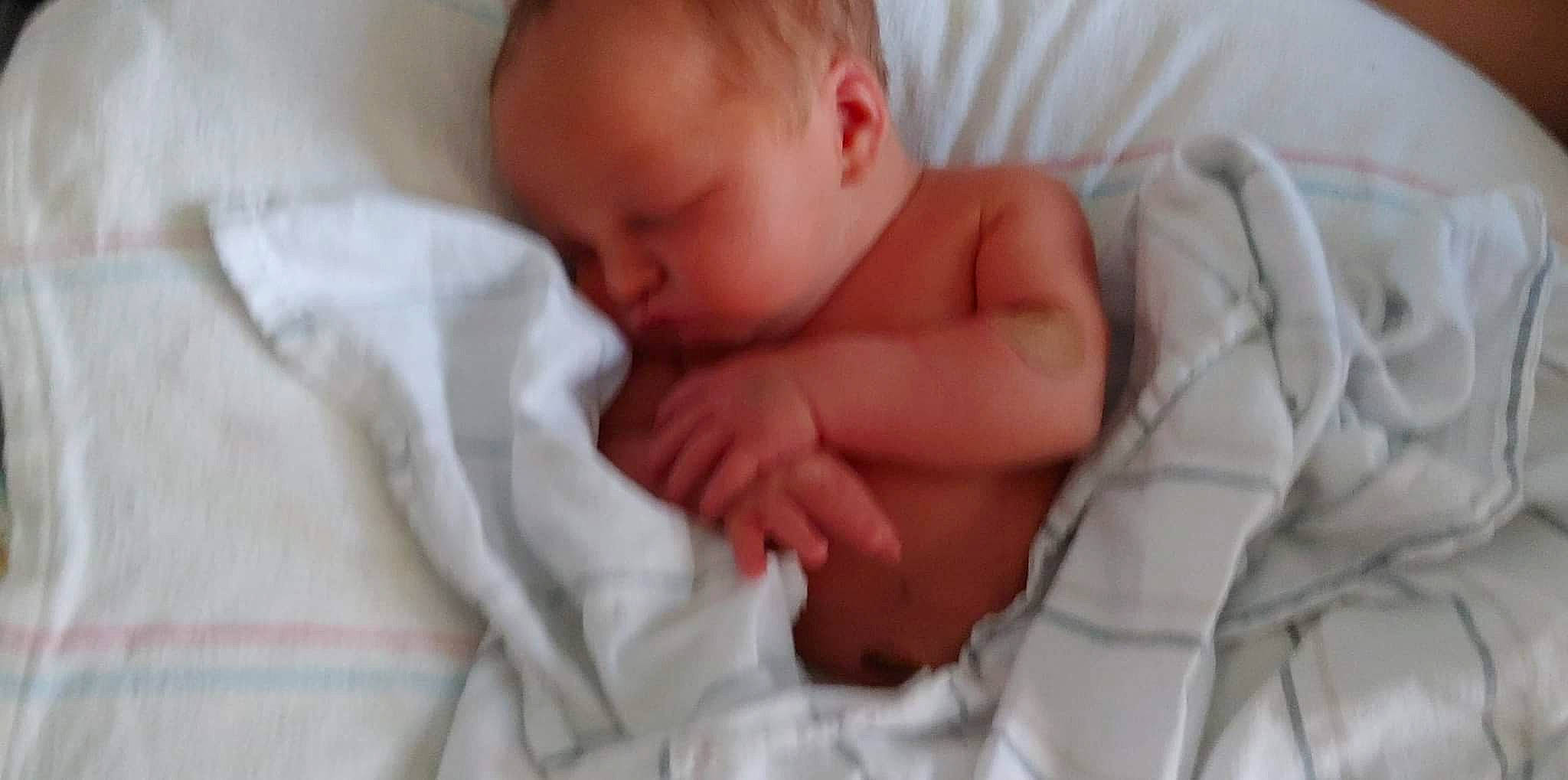 Zaiden is registered to the contest to win money with this photo: abdomen, baby, baby_products, baby_sleeping, baby_toddler_clothing, bedding, bedtime, blanket, cheek, child, childbirth, comfort, event, fur, hand, linens, nap, person, sleep, thumb
