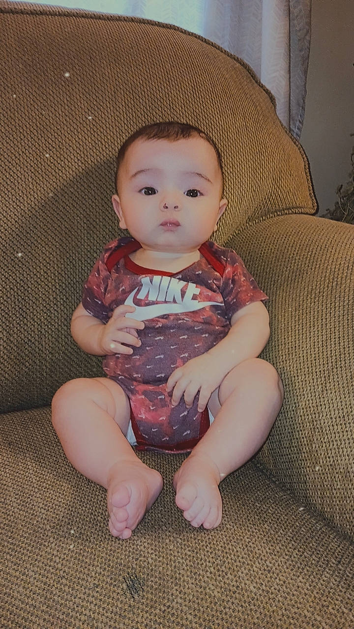 Kingston is registered to the contest to win money with this photo: baby, baby_toddler_clothing, barefoot, cheek, comfort, eye, face, flash_photography, foot, head, human_leg, iris, lip, neck, person, skin, sleeve, thigh, toddler, trunk