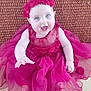 baby, child, smiling, dress, flower_headband, pink, happy, sitting, cute, portrait, infant, hand, blue_eyes, fabric, texture, background, floor, person, indoor, young