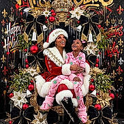 Kiylee is registered to the contest to win money with this photo: child, santa, christmas, holiday, portrait, smiling, laughing, festive, red_suit, pink_pajamas, throne, crown, poinsettia, ornaments, bells, bows, christmas_tree, floral_arrangement, black_background, family