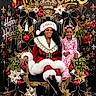 child, adult, mother, daughter, smiling, portrait, christmas, santa_hat, festive, holiday, throne, ornaments, decorations, bows, poinsettias, bells, red_dress, pink_pajamas, indoor, family