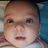 Abigail Joy is registered to the contest to win money with this photo: baby, close_up, face, infant, child, portrait, skin, eyes, nose, mouth, head, person, young, blur, indoor, cute, expression, sleepwear, blanket, soft
