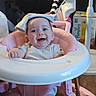 baby, walker, smiling, infant, pink, white, clothing, face, child, indoor, happy, toy, baby_equipment, pampers, seat, floor, headwear, cute, person, babywalker