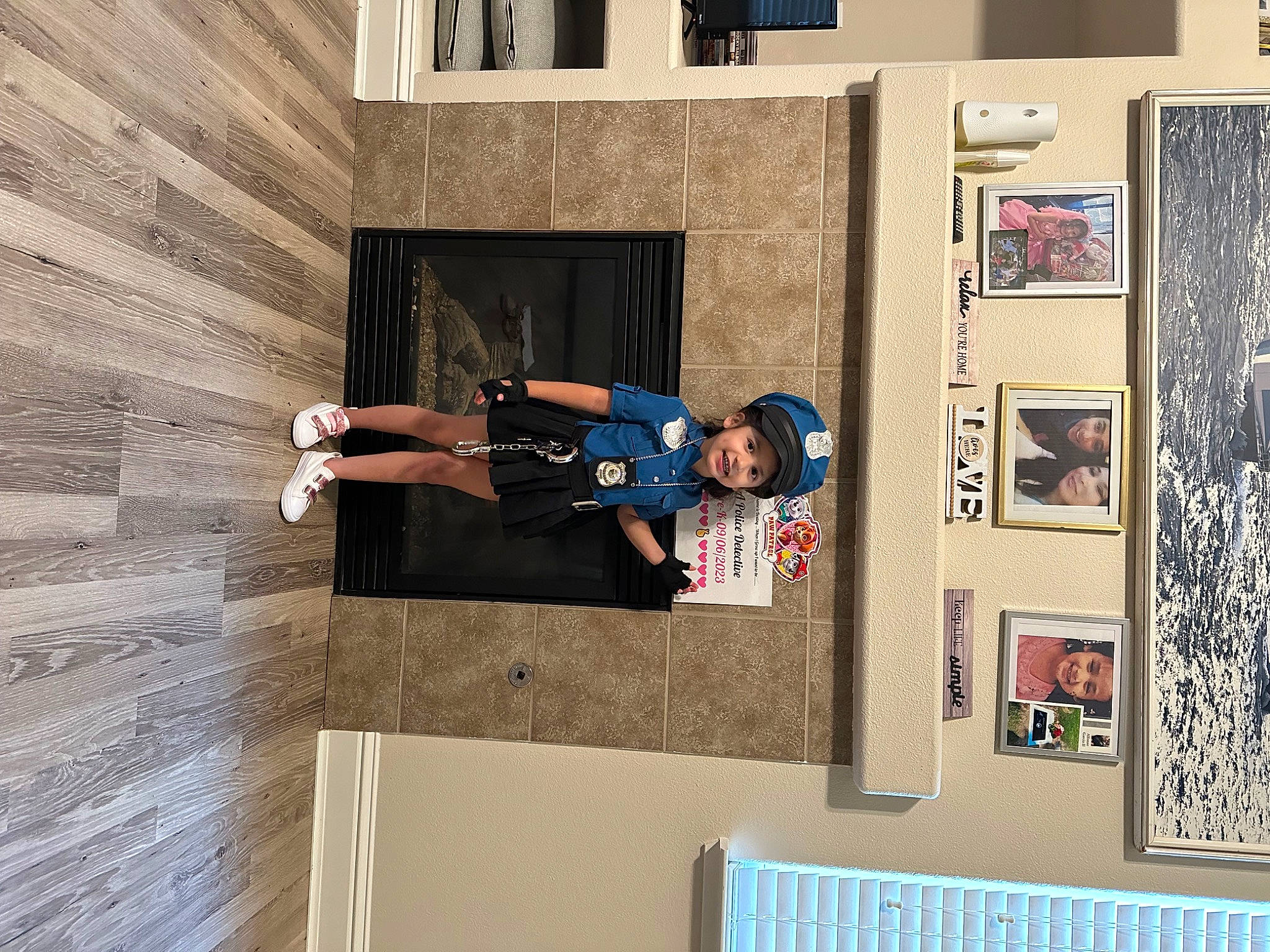 Destiny is registered to the contest to win money with this photo: art, building, concrete, facade, flooring, font, hardwood, headwear, house, joy, person, rectangle, room, shelving, stairs, t_shirt, textile, visual_arts, wood