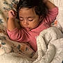 Nylah joined the competition — help win amazing prizes! baby, sleeping, blanket, pink_clothing, curly_hair, face, infant, cozy, soft_texture, floral_pattern, peaceful, closeup, resting, child, portrait, indoors, cute, adorable, toddler, warm