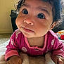 Nylah joined the competition — help win amazing prizes! baby, child, infant, curly_hair, pink_clothing, blanket, indoor, portrait, cute, face, hands, soft_texture, expression, young_child, cozy, closeup, person, looking_up, curiosity, warm_lighting