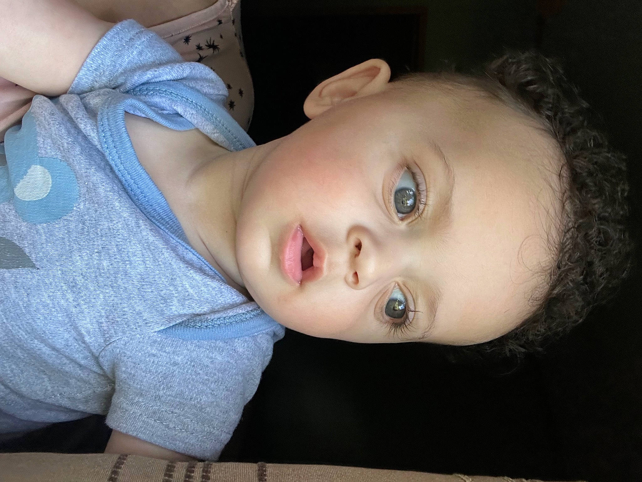 Ezra is registered to the contest to win money with this photo: baby, baby_toddler_clothing, cheek, child, comfort, eyebrow, eyelash, flash_photography, human_body, iris, lip, mouth, neck, nose, person, sitting, skin, sleeve, toddler, tree