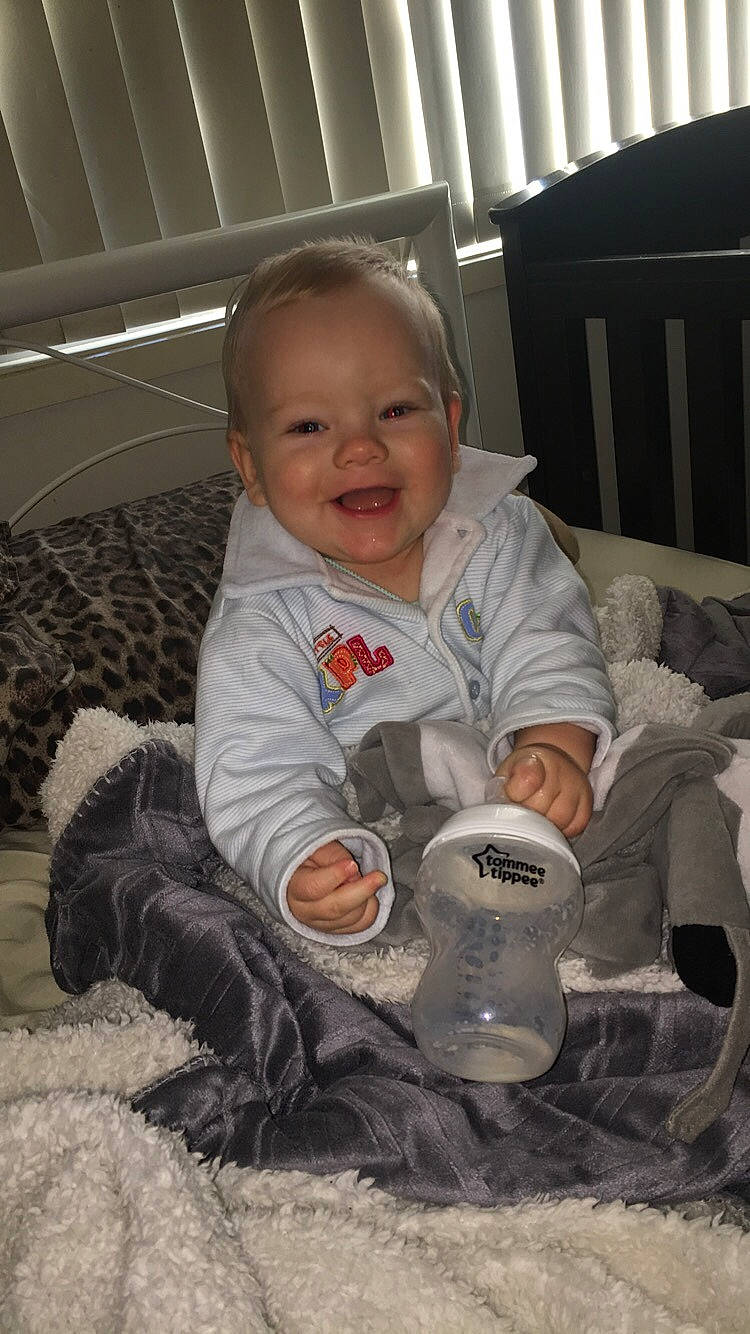 Coen is registered to the contest to win money with this photo: baby, child, joy, person, play, sitting, smile, toddler