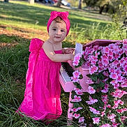 Aykanush Arpine is registered to the contest to win money with this photo: toddler, child, pink_dress, headband, piano, flowers, outdoor, grass, greenery, nature, daylight, portrait, cute, playing, music, toy_piano, flower_decoration, young_child, colorful, park