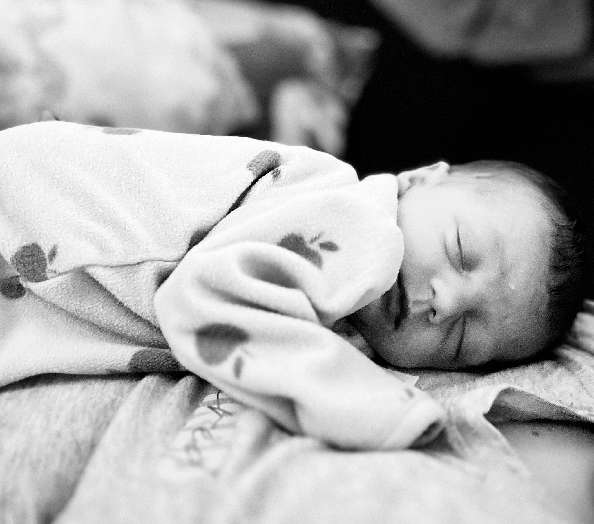 Alexis Rose is registered to the contest to win money with this photo: baby, bedtime, black_and_white, child, comfort, flash_photography, fur, gesture, happy, monochrome, monochrome_photography, nap, person, portrait, portrait_photography, room, sitting, skin, sleep, stock_photography