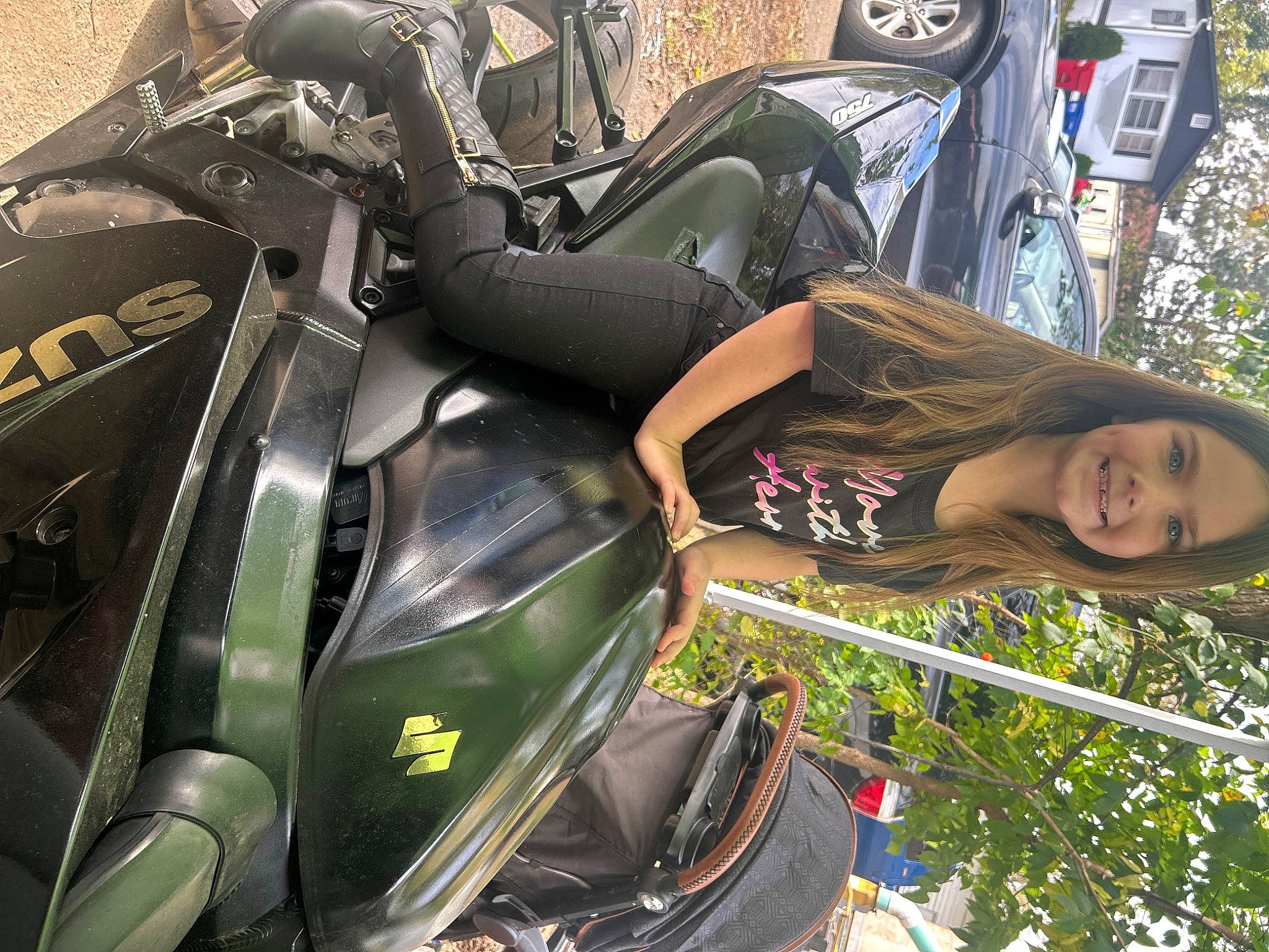 Aubrianna is registered to the contest to win money with this photo: automotive_design, automotive_exterior, automotive_lighting, automotive_tire, automotive_wheel_system, fender, fuel_tank, headlamp, helmet, hood, joy, motor_vehicle, motorcycle, person, personal_luxury_car, plant, tire, tree, vehicle, vehicle_door