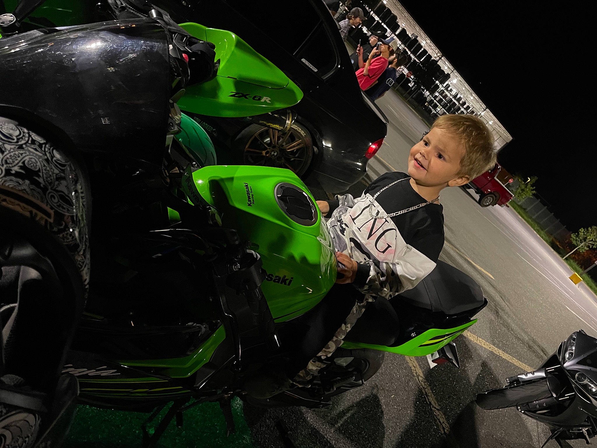 Leland joined the competition — help win amazing prizes! auto_part, automotive_design, automotive_exterior, automotive_lighting, automotive_tire, automotive_wheel_system, fender, flash_photography, fuel_tank, headlamp, mode_of_transport, motor_vehicle, motorcycle, motorcycle_accessories, motorcycle_fairing, person, personal_protective_equipment, rim, tire, vehicle