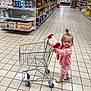 Nysia participe au concours pour gagner de l'argent avec cette photo : aisle, baby, child, cute, floor, floor_tiles, girl, grocery_store, hair_tie, indoor, pink_clothing, portrait, sandals, shopping, shopping_cart, small_cart, smiling, supermarket, toddler, young_child