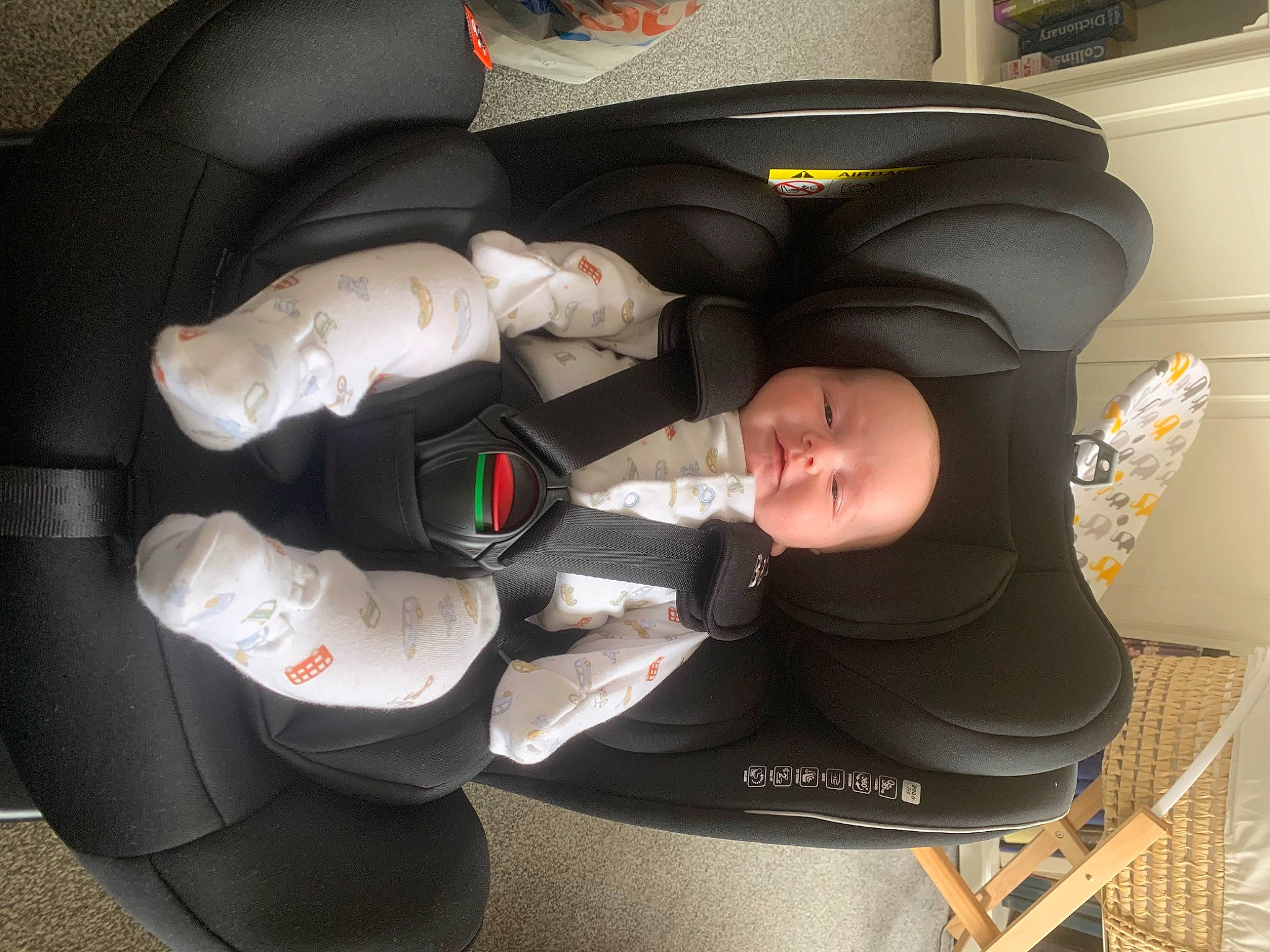 Hudson is registered to the contest to win money with this photo: auto_part, automotive_design, automotive_exterior, automotive_wheel_system, baby_carriage, car, car_seat, car_seat_cover, comfort, hat, head_restraint, headgear, motor_vehicle, outerwear, person, personal_luxury_car, personal_protective_equipment, shoe, steering_wheel, toddler