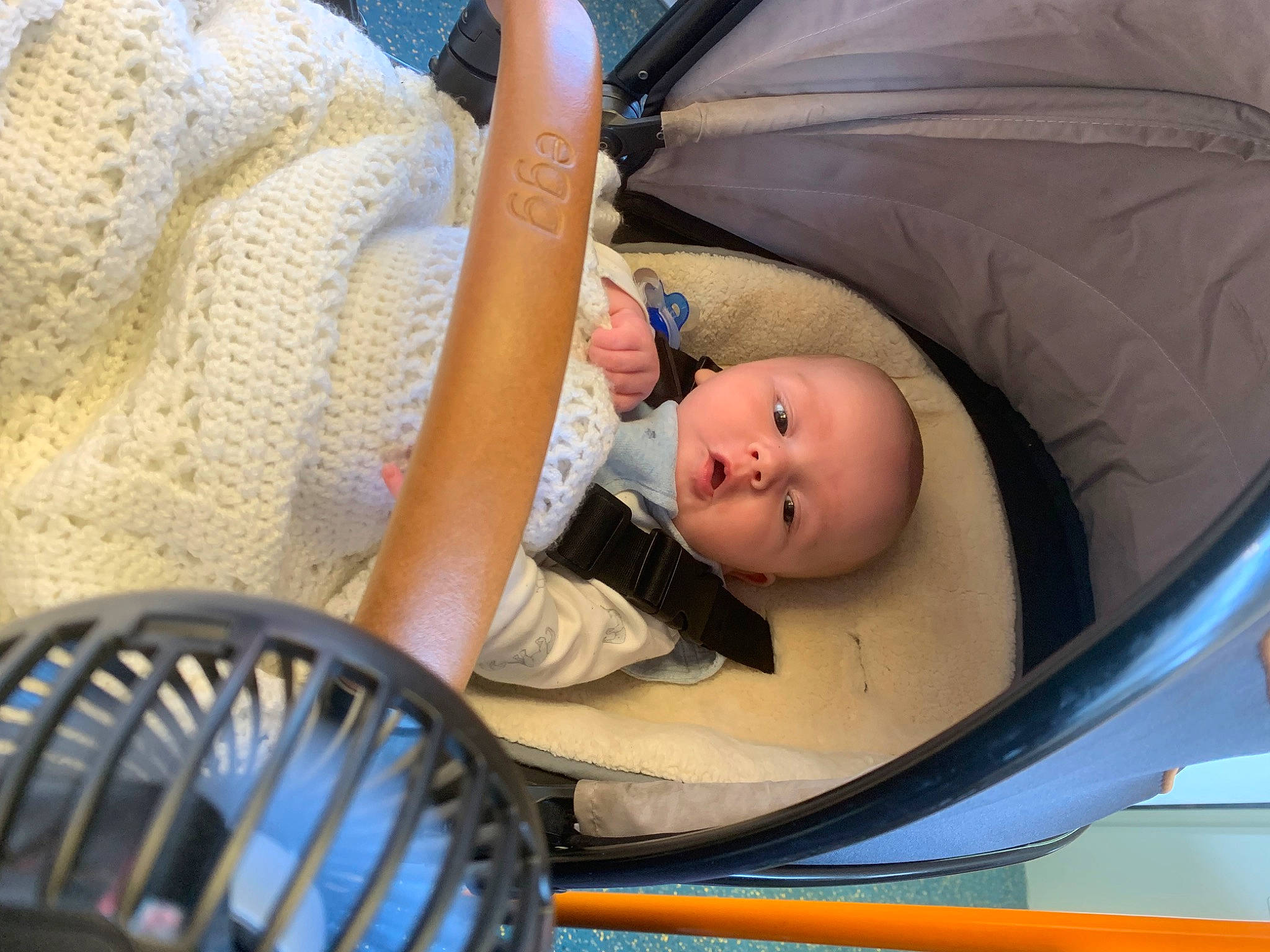 Hudson is registered to the contest to win money with this photo: baby, baby_carriage, baby_products, baby_safety, baby_toddler_clothing, chair, child, comfort, face, hat, infant_bed, leisure, people, person, room, sitting, toddler, vacation, windsor_chair
