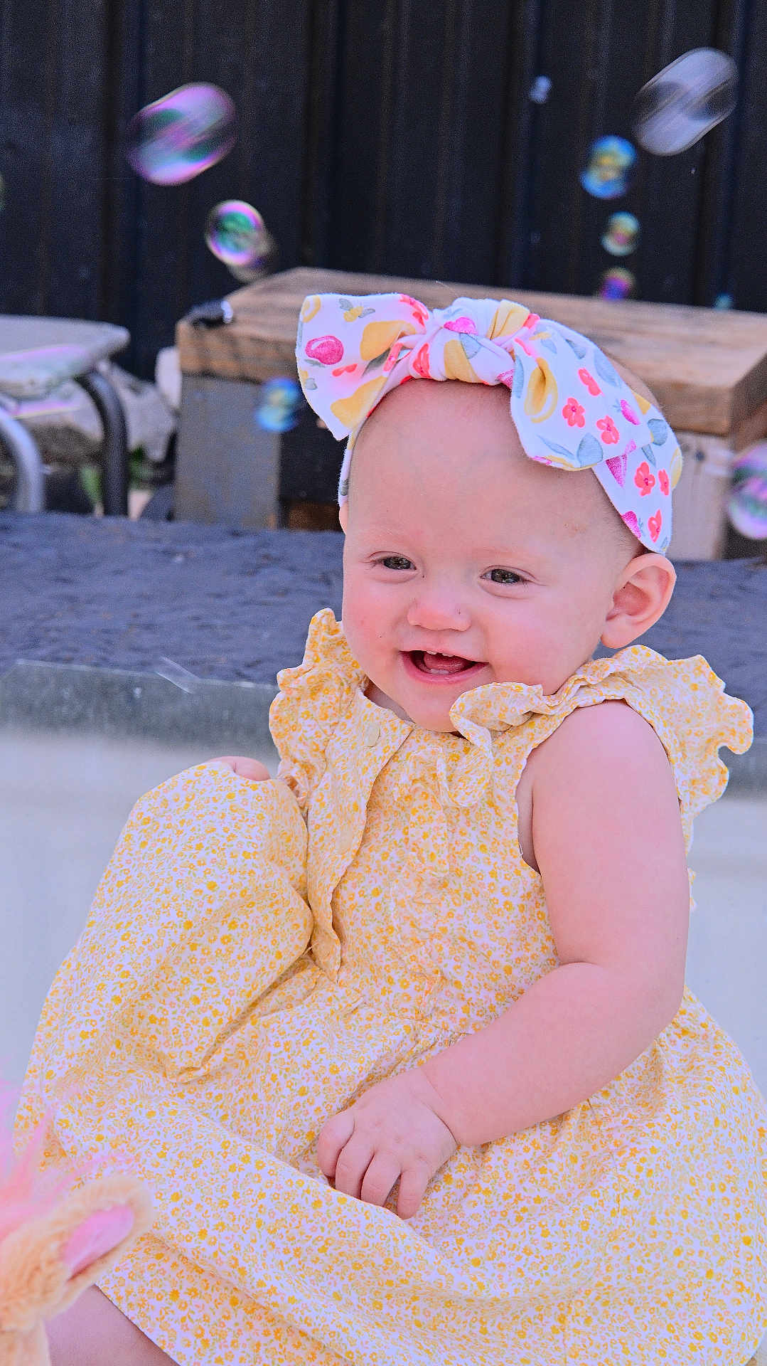 Sunshine is registered to the contest to win money with this photo: baby, child, smiling, dress, headband, bow, bubbles, outdoor, happy, cute, infant, playful, colorful, person, portrait, summer, fun, joy, young, skin