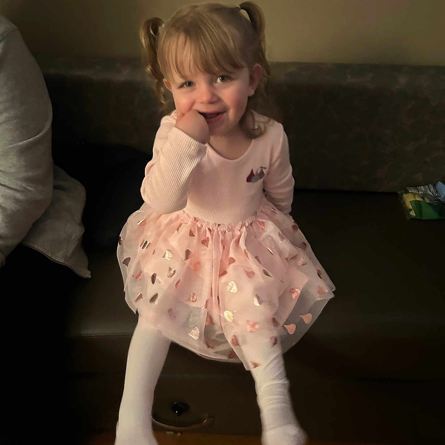 Paisley is registered to the contest to win money with this photo: adult, architecture, child, clothing, couch, dress, face, female, furniture, girl, hardwood, head, male, man, person, photography, portrait, sitting, skirt, wood