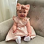 baby, child, pink_dress, headband, bow, smiling, sitting, armchair, indoor, natural_light, happy, cute, infant, white_socks, furniture, portrait, toddler, soft_texture, window, cozy