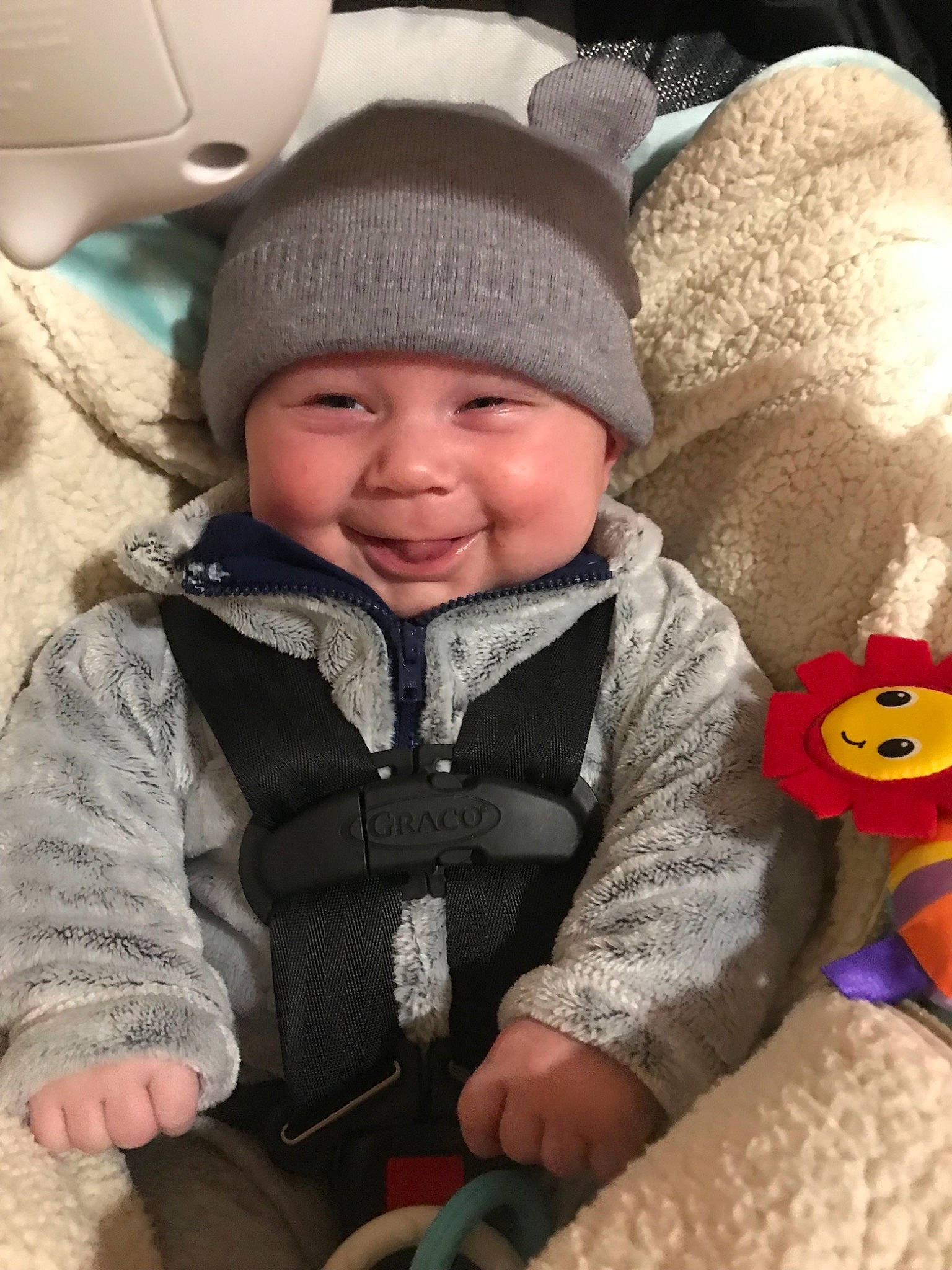Nicholas is registered to the contest to win money with this photo: baby, baby_in_car_seat, child, hat, headgear, joy, person, product, toddler, wool