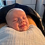 Casey joined the competition — help win amazing prizes! baby, smile, sleeping, blanket, face, tongue, infant, closeup, wrapped, cozy, child, indoors, soft_light, peaceful, cute, newborn, person, relaxed, portrait, young_child