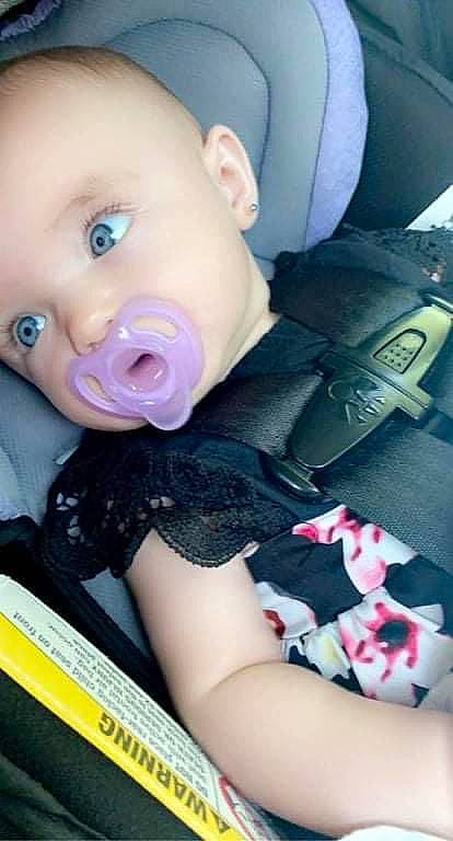 Saphron is registered to the contest to win money with this photo: baby, baby_products, baby_toddler_clothing, cheek, child, comfort, cool, eyelash, facial_expression, finger, fun, happy, iris, lip, mouth, nose, person, pink, sitting, skin