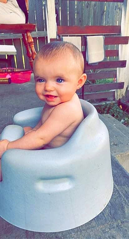 Saphron is registered to the contest to win money with this photo: arm, baby, baby_toddler_clothing, cheek, child, electric_blue, eyebrow, finger, floor, flooring, fun, happy, leisure, mouth, person, sitting, skin, smile, standing, toddler